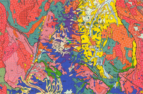Cadre géologique de Saint-Nectaire (flèche verte) sur un extrait de la carte géologique de France au 1/1 000 000